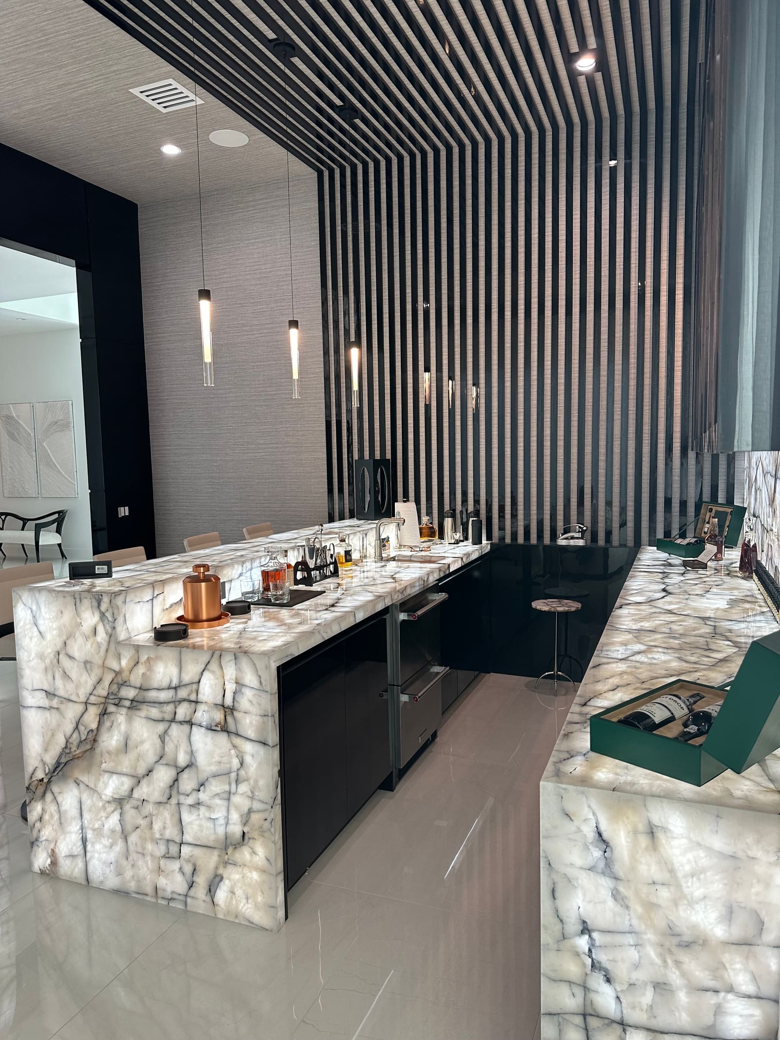 Custom bar with stone waterfall counters